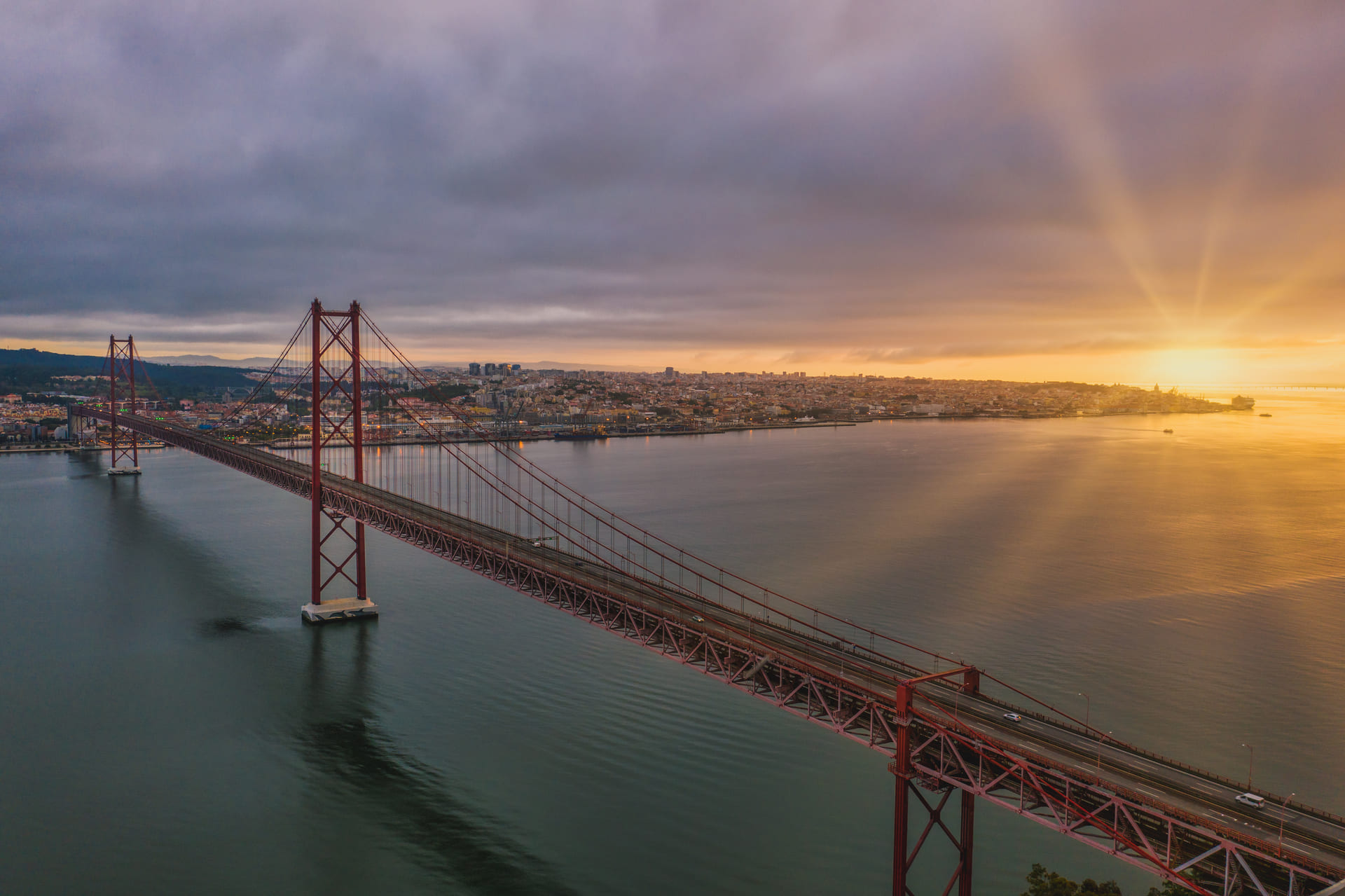 Aerial view shot suspension bridge portugal beautiful sunset (1) (1)